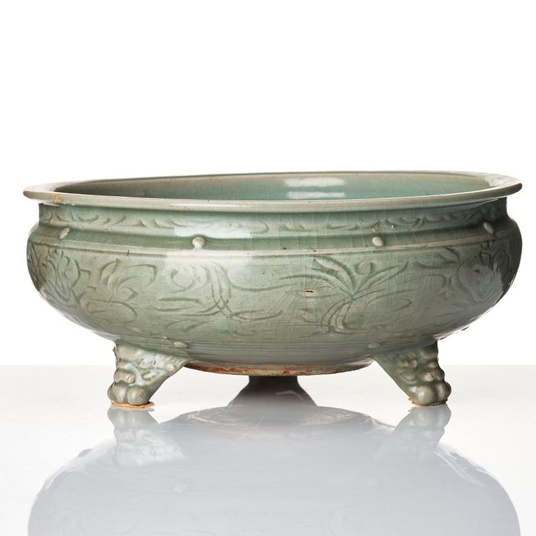 A celadon glazed tripod censer, Ming dynasty (1368-1644).