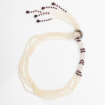 A sweet water, rose quartz, garnet and wood pearls collier with a Tiffany & co silver ring designed by Elsa Peretti.