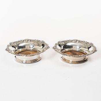 A pair of silver plated coasters, England 20th century.