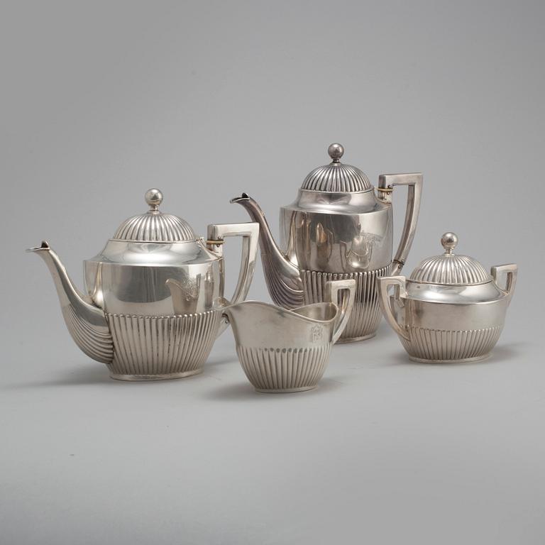 A FOUR PIECE SILVER TEA- AND COFFEE SERVICE, first half of the 20th century. Total weight ca 1300 g.