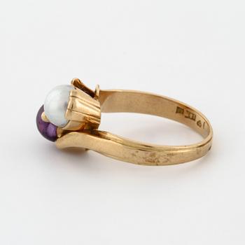 A cultured pearl and cabochon cut amethyst ring by  Stigert, Stockholm, 1955.