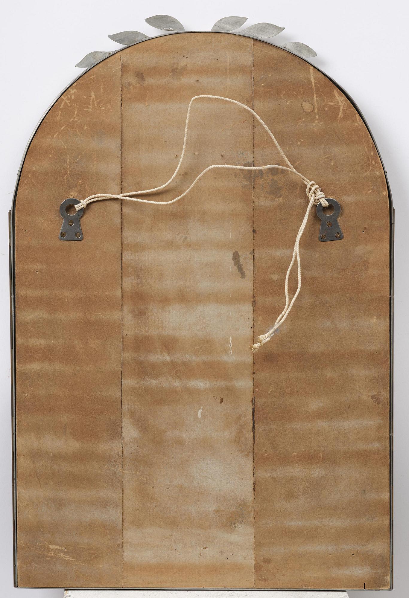 Estrid Ericson, a pewter framed mirror modell "A 884", Firma Svenskt Tenn, Stockholm, 1934.