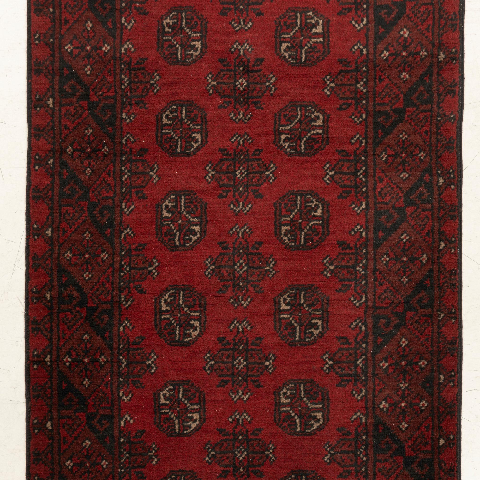 An oriental / Afghan runner, approx. 478 x 81 cm.