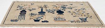 A semi-antique pictoral Chinese rug, approx. 240 x 170 cm.