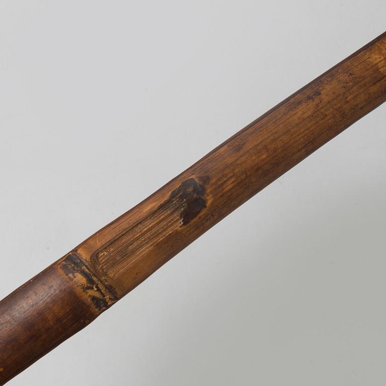 A 19th/20th century south-east asian bow with an arrow.