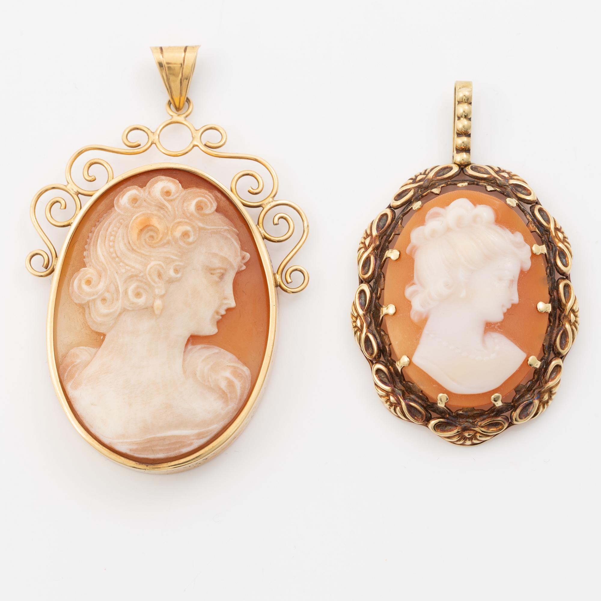 Two gold and shell cameo pendants.