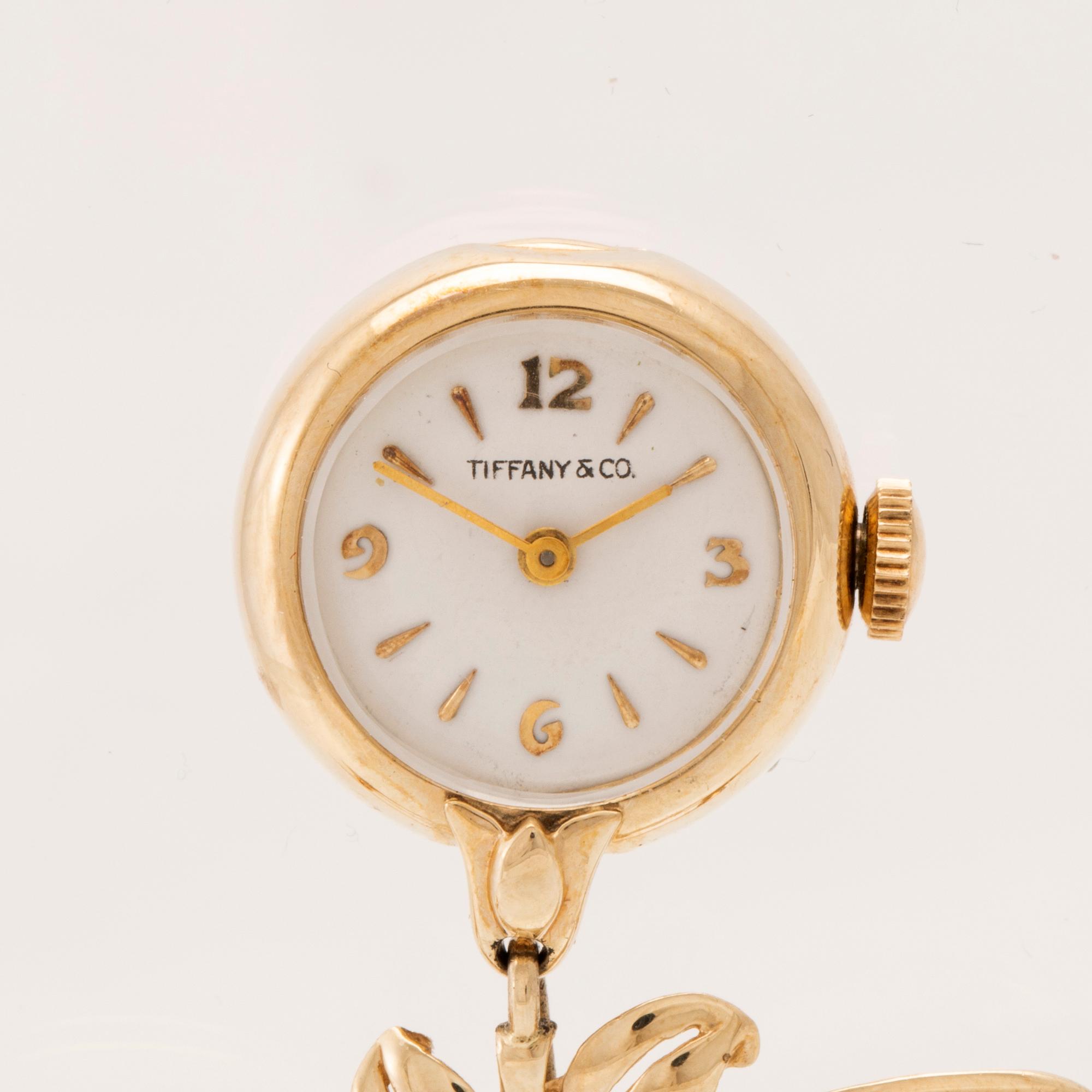 Tiffany & Co fickur/brosch 14K guld.