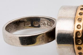 2 RINGS, 18K gold w smoky quartz approx 14 mm, silver and gold w rock crystal approx 16 mm, Stockholm 1963.