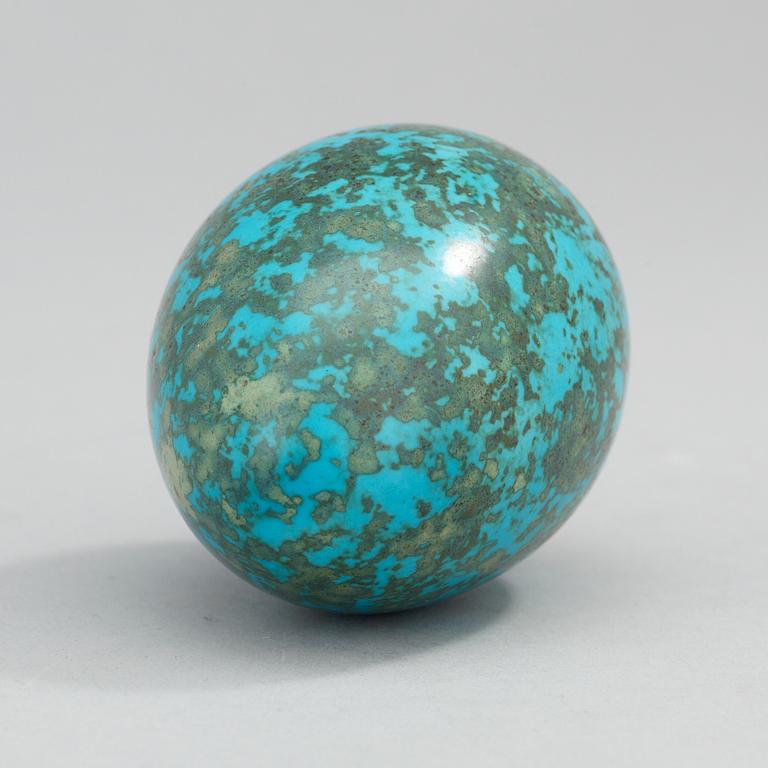 A Hans Hedberg faience egg on an iron base, Biot, France.