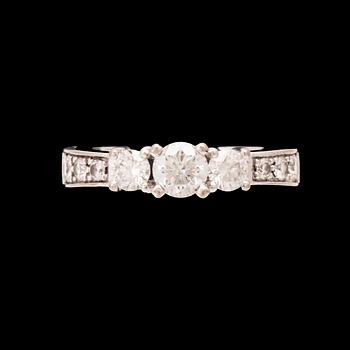 An 18K white gold ring set with round brilliant cut diamonds.