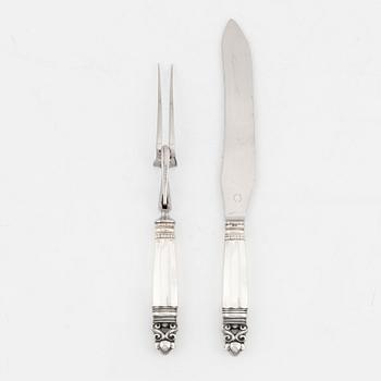 Johan Rohde, A sterling silver carving knife and fork set, 'Konge/Acorn', Georg Jensen, Denmark.