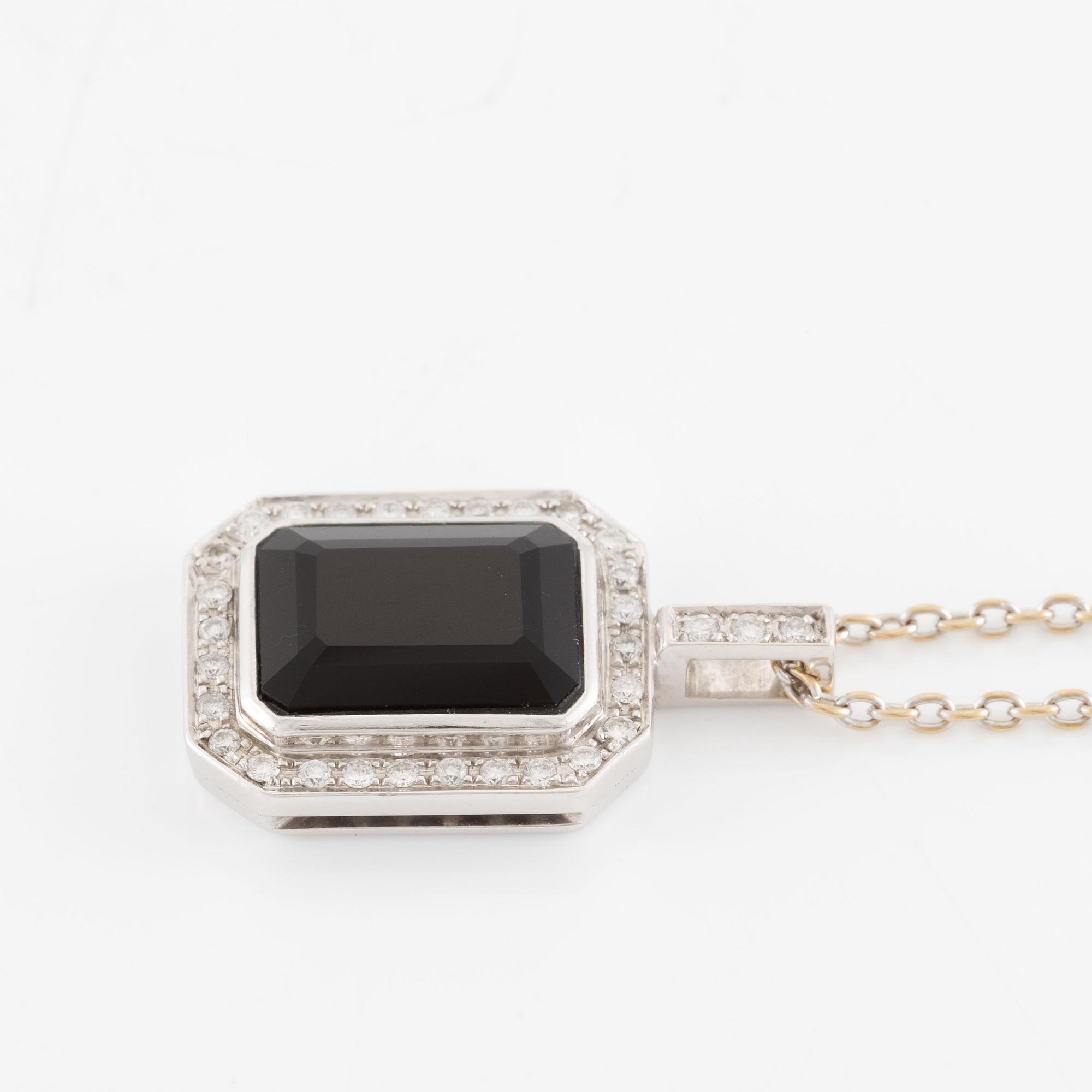 Pendant in 18K white gold set with brilliant-cut diamonds and likely onyx, with chain.
