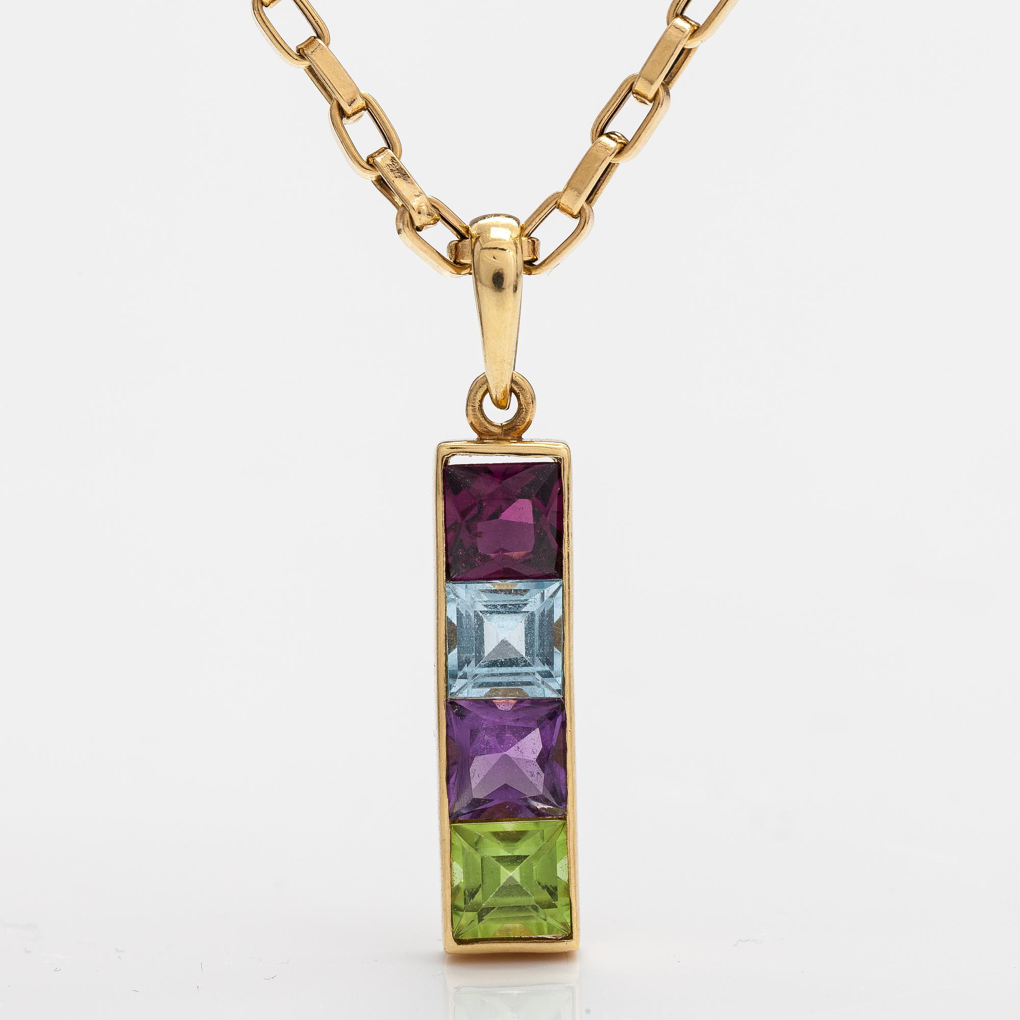 An 18K gold necklace with a garnet, peridote, amethyst and topaz.