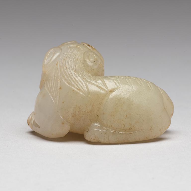 A Chinese nephrite snuff bottle, pendant and figurine.