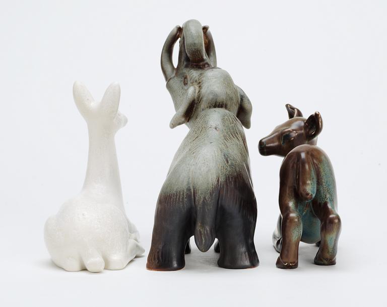 Three Gunnar Nylund stoneware figures, two deer and a mammoth, Rörstrand.