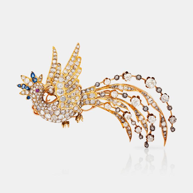 An old- and rose-cut diamond, sapphire and ruby brooch in the shape of a bird.