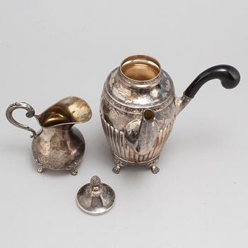 A silver coffee pot and creamer, Stockholm, 1875-1917.