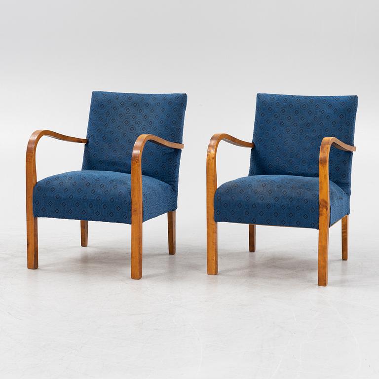 A a pair of stained birch armchairs 1930s-40s.