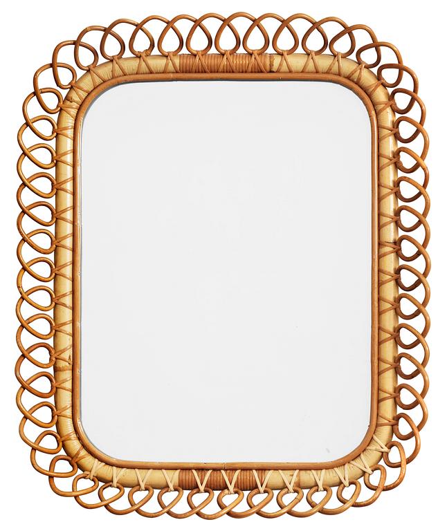 A Josef Frank mirror with a rattan frame by Svenskt Tenn.