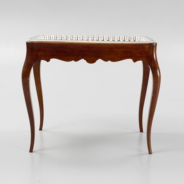 A Rococo style tea table, Rörstrand, 1918.