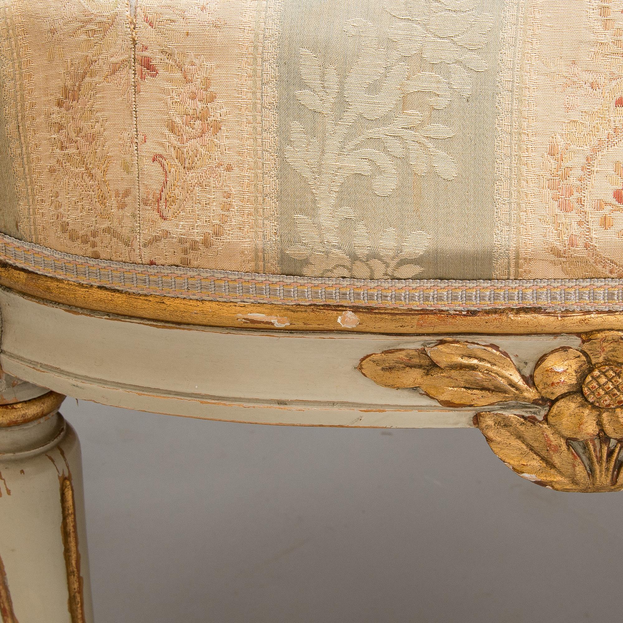 A Gustavian style sofa and table from early 20th century.