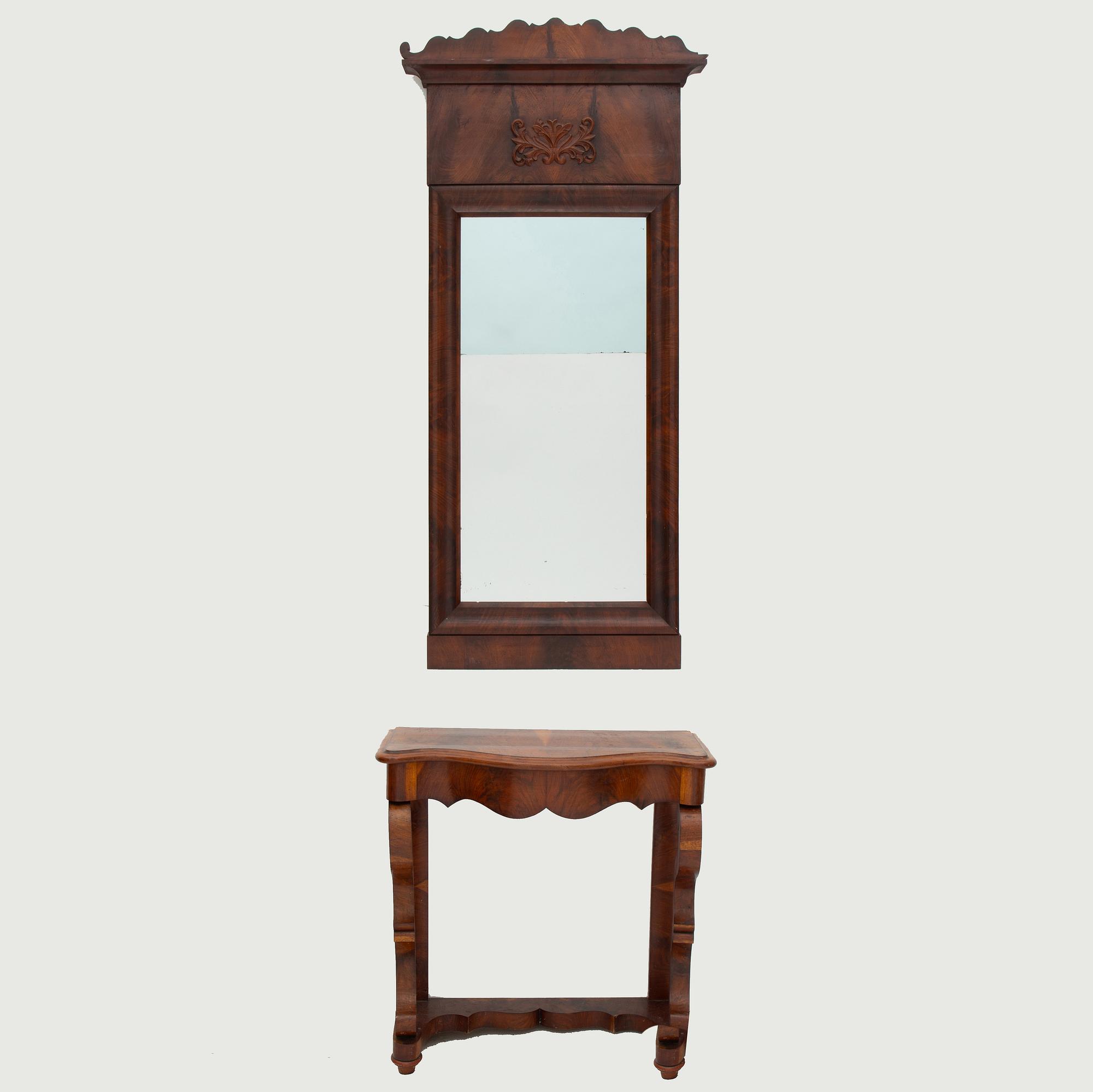 A Swedish Empire mirror with a console table, first half of the 19th Century.