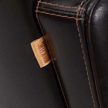 A pair of Italian leather armchairs from  Industria Divani e Poltrone, 21st-century.