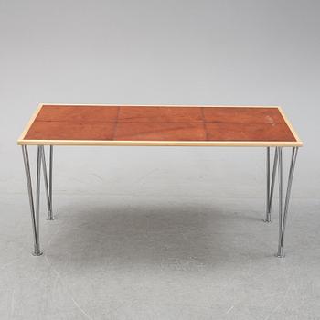 A birch and leather dining table produced by Mathsson International, 21th century.