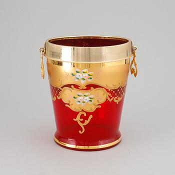 A red glass wine cooler.