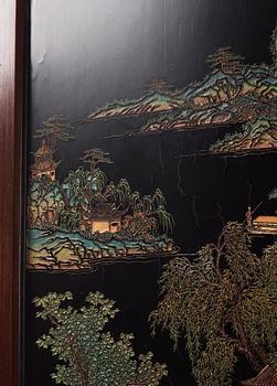 A set of four Chinese lacquer panels with wooden frames, early 20th century.