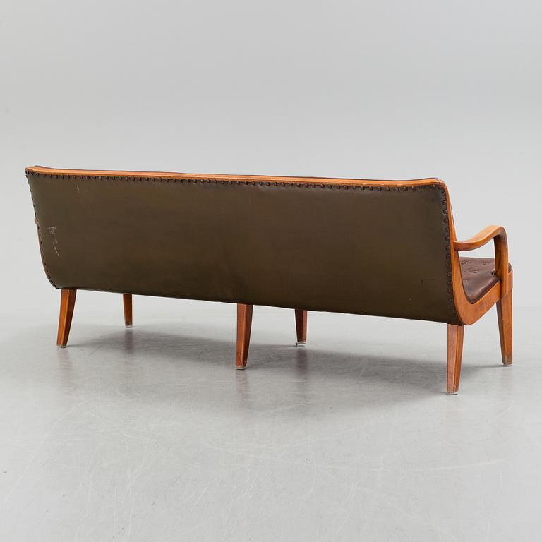 An Axel Larsson stained beech leather upholstered sofa, Svenska Möbelfabrikerna Bodafors, 1930's.