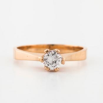 A brilliant cut diamond ring.