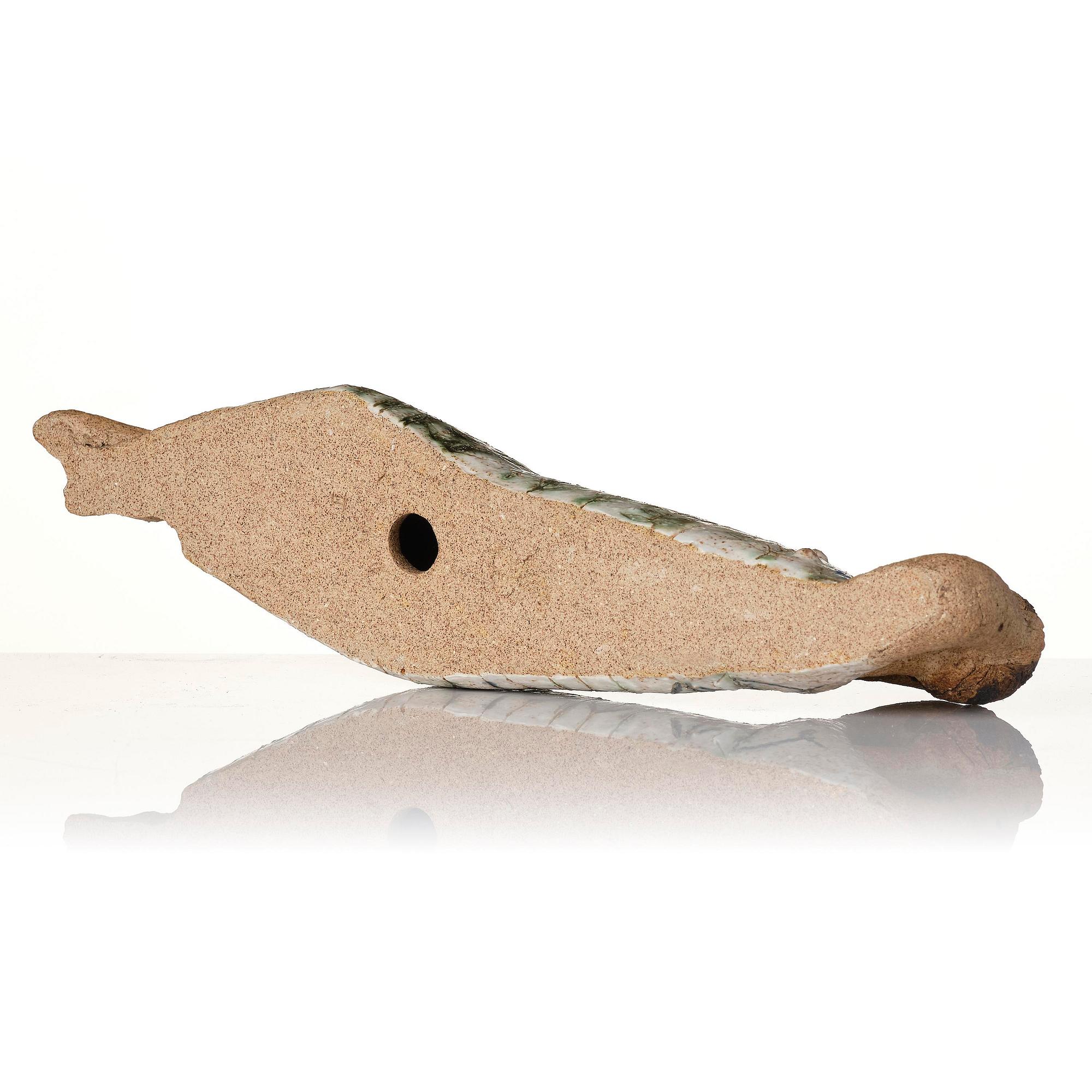 Lisa Larson, a unique chamotte stoneware sculpture of a reclining female figure with a bird, Gustavsberg Studio, probably 1950s-60s.