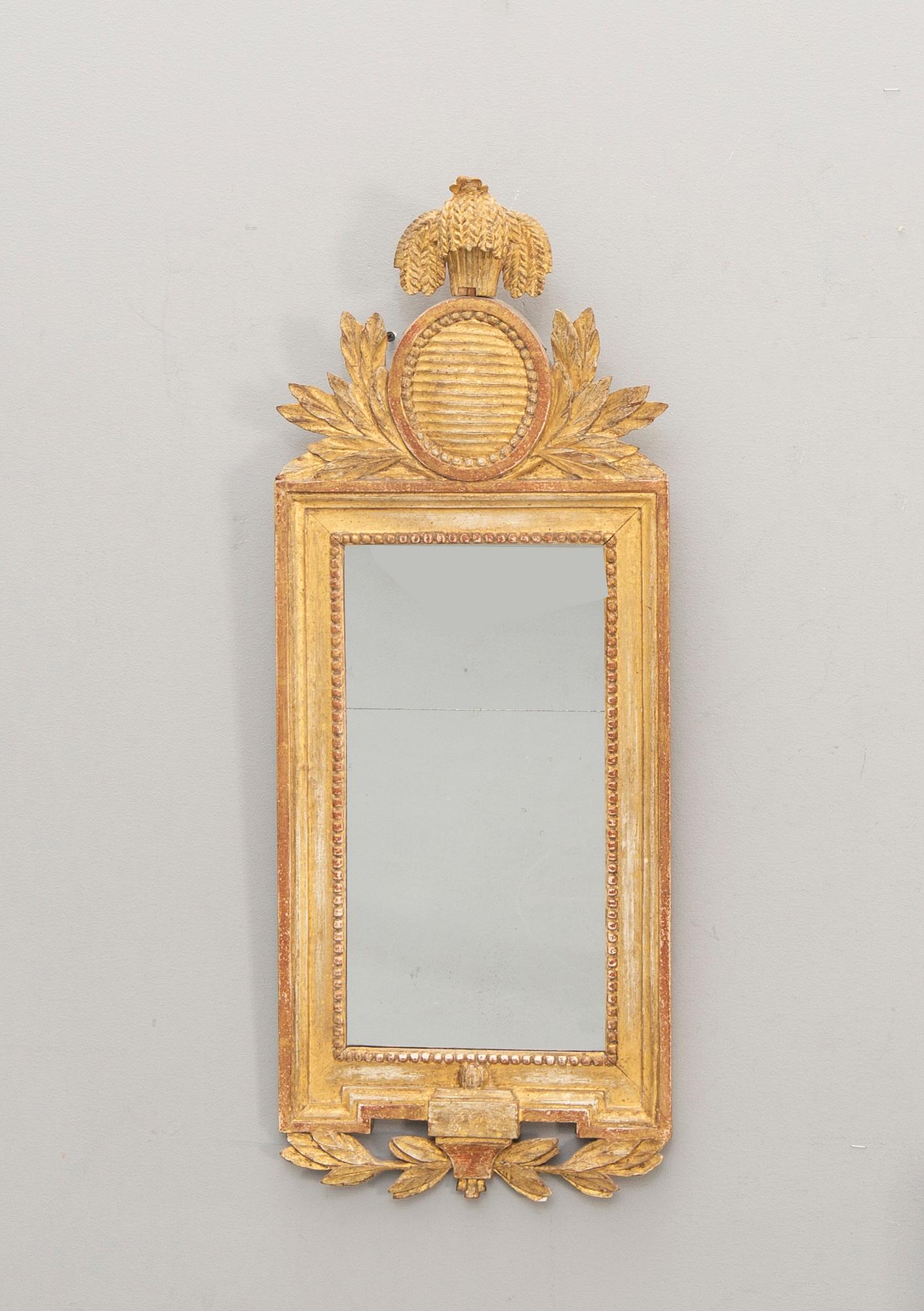 A Swedish gilded signed Gustavian mirror by CG Fyrwald.