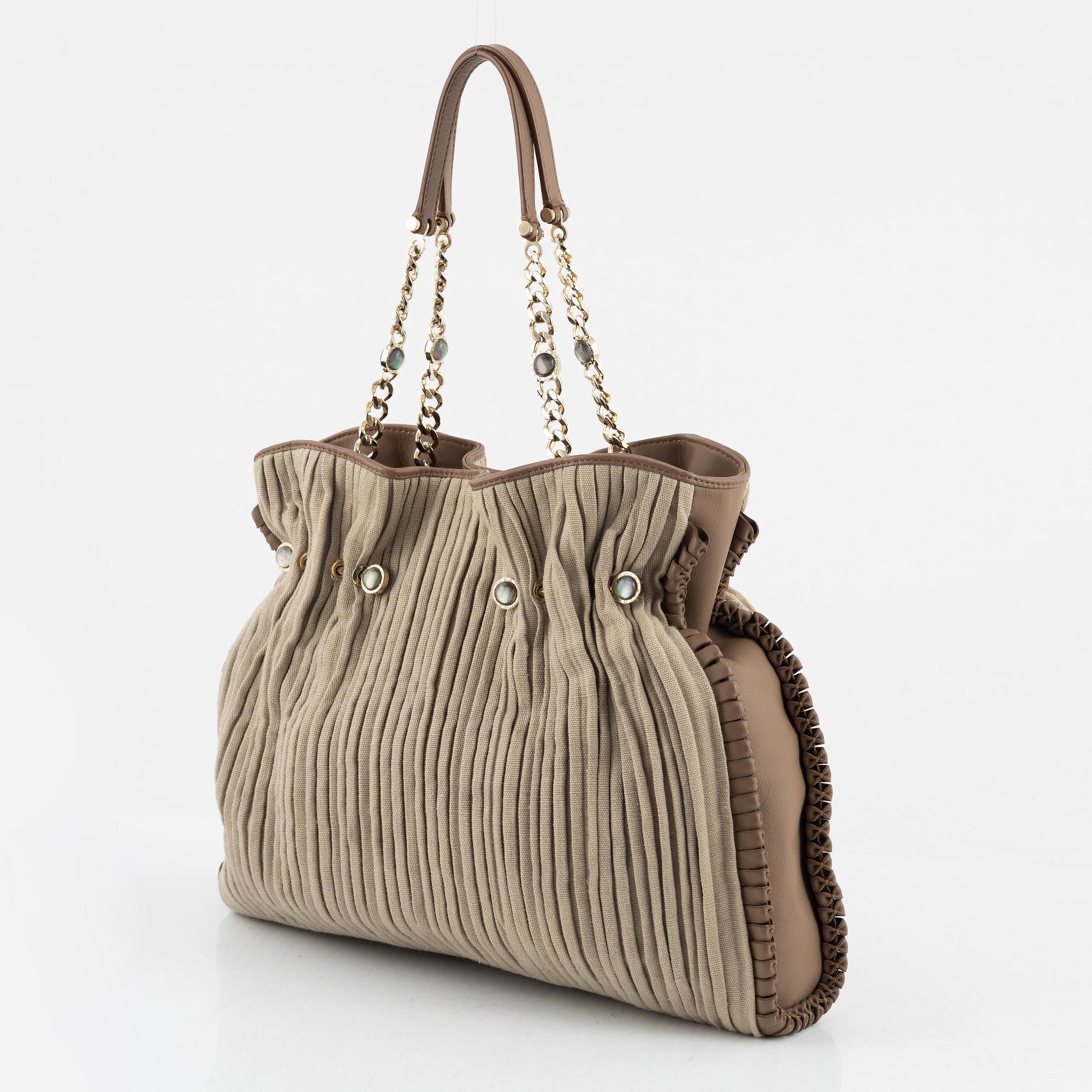 Bulgari, a leather and canvas bag.
