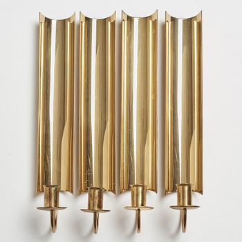 A set of four 'Reflex' brass wall scones by Pierre Forsell, Skultuna.