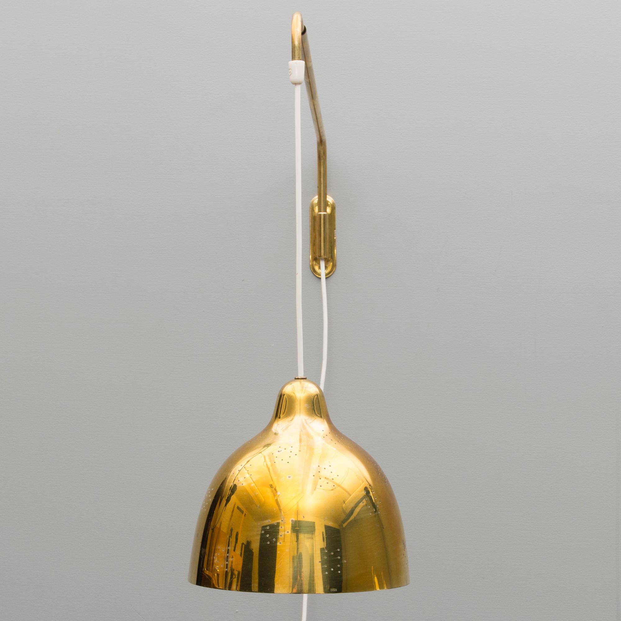A mid 20th century wall light for Stockmann Orno, Finland.