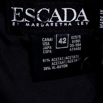 ESCADA, a black coctaildress with gold colored sequins.