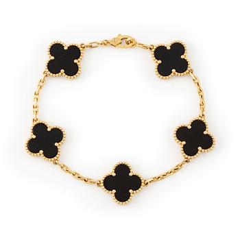 522. A Van Cleef & Arpels bracelet "Alhambra" 18K gold with onyx.