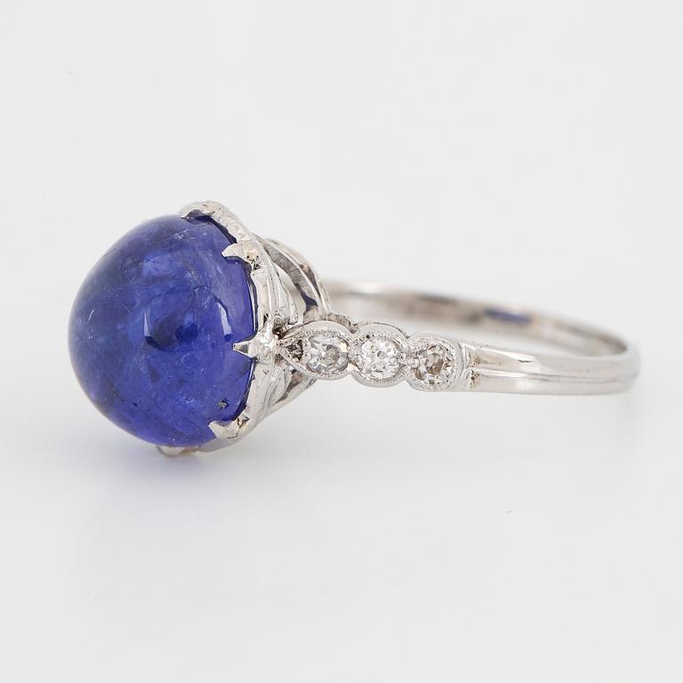 Cabochon-cut tanzanite and brilliant-cut diamond ring.