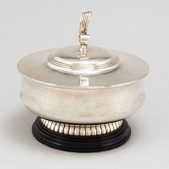 A parcel gilt silver bowl on a wooden base by CG Hallberg Stockholm 1934.