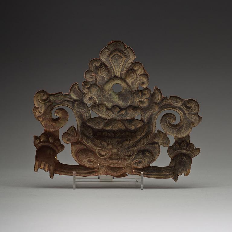 A Tibetan gilt metal ornament, 19th Century.