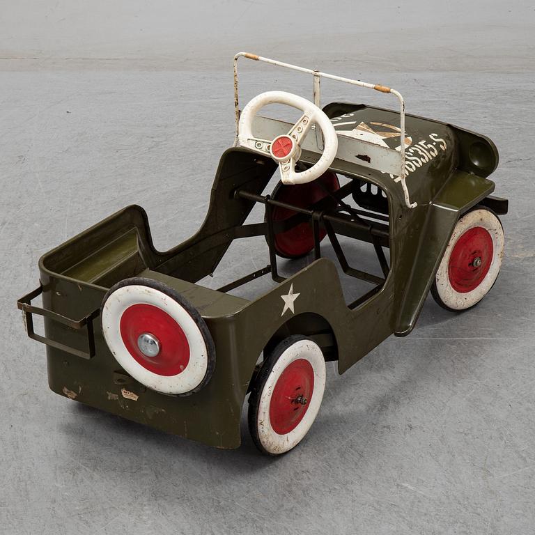 A sheet metal pedal car from the second half of the 20th century.