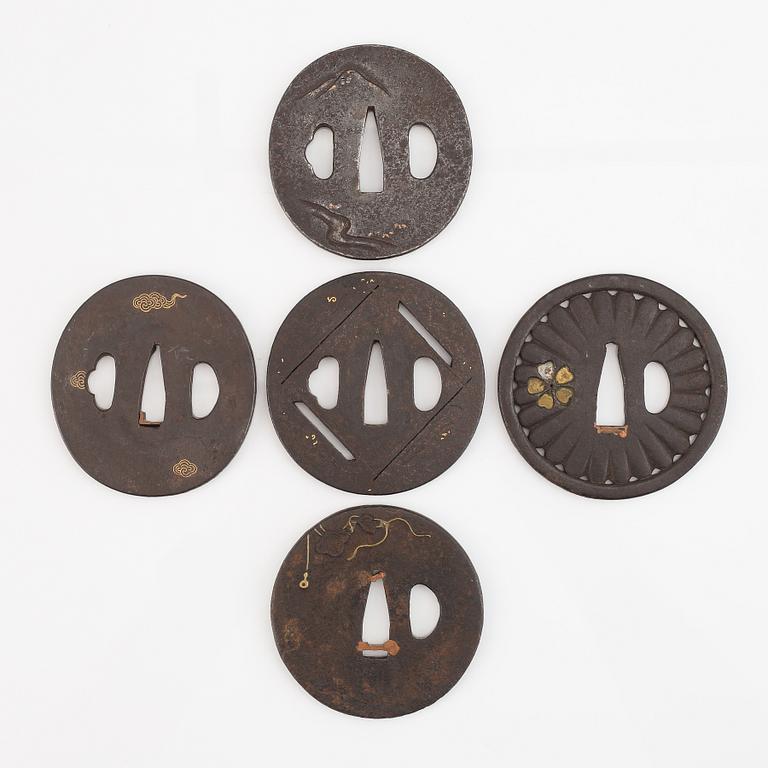 Five iron tsubas, one signed, Edo period.