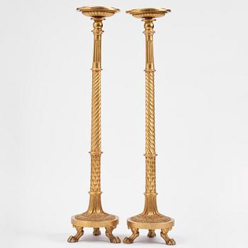 A pair of late Gustavian giltwood torchères by J. Frisk (master in Stockholm 1805-24).
