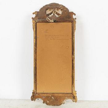 A giltwood rococo mirror by J. Schürer (master in Stockholm 1769).