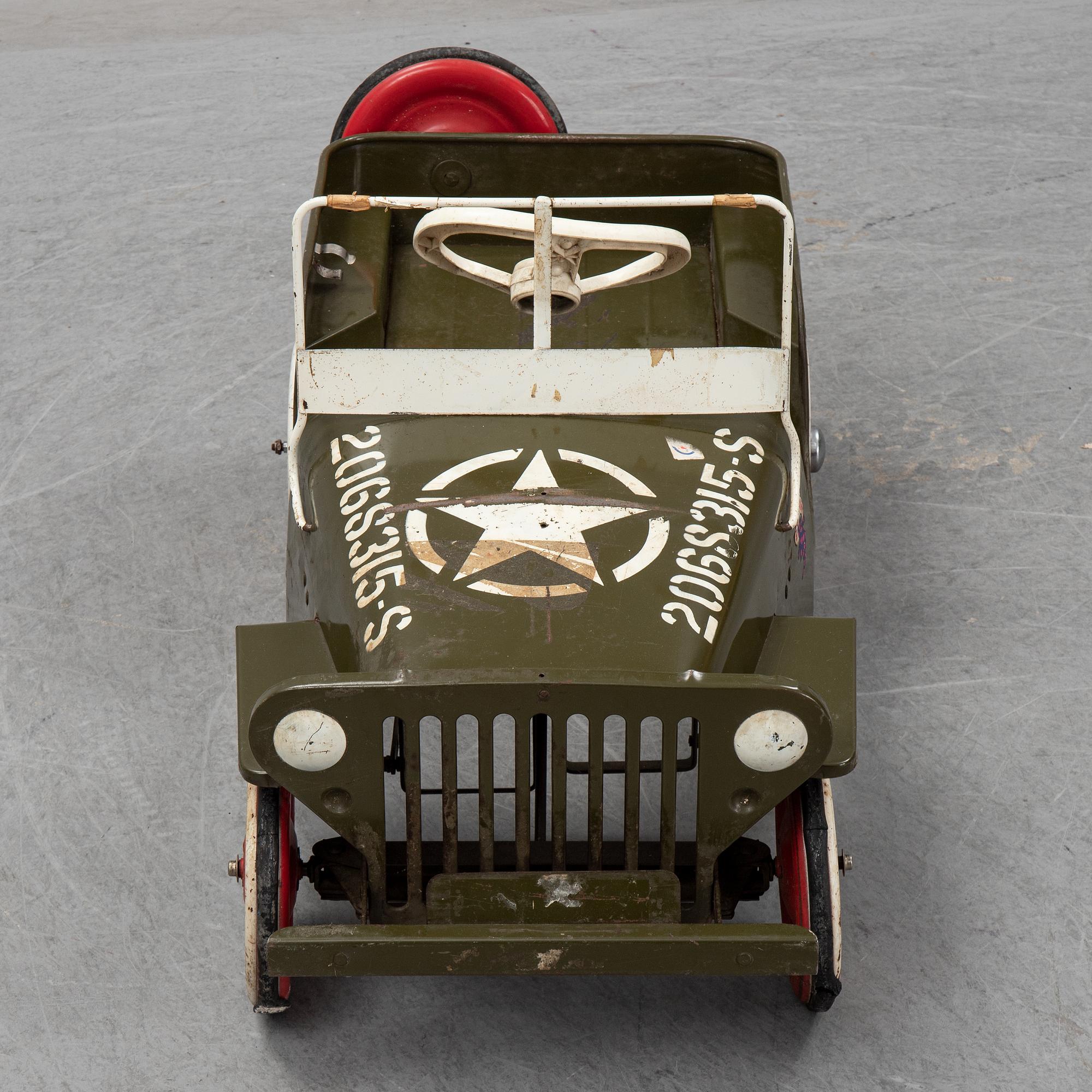 A sheet metal pedal car from the second half of the 20th century.