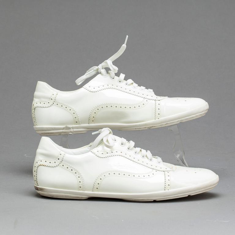 A pair of Louis Vuitton shoes.