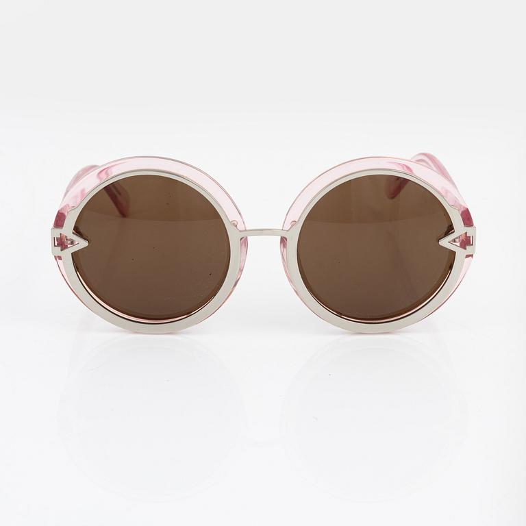 Karen Walker, a pair of pink "Orbit" sunglasses.