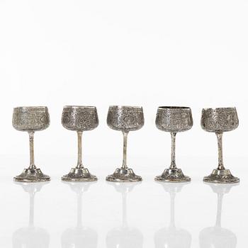 A Persian silver pitcher with five stemmed cups and a beaker, first part of the 1900s.